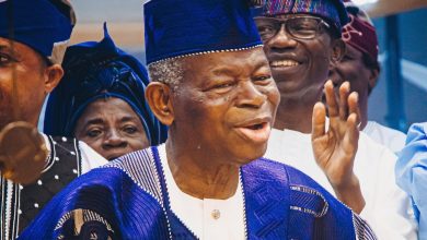 Pastor Elijah Oludele Abina dancing joyfully at his 90th birthday celebration surrounded by church members