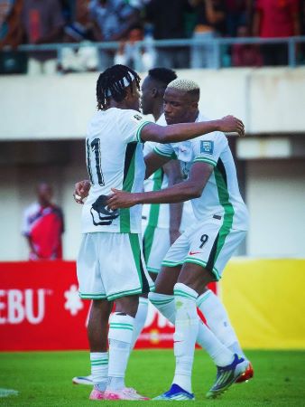 Victor Osimhen celebrates with other players after Super Eagles' victory over Benin Republic